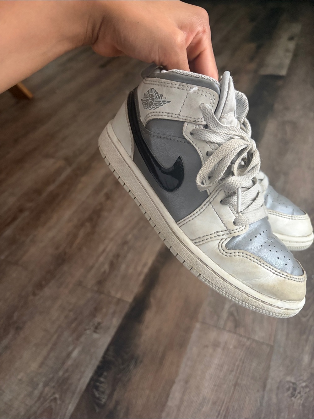 Nike Kids White and Gray High-Top Sneaker with Black Swoosh
